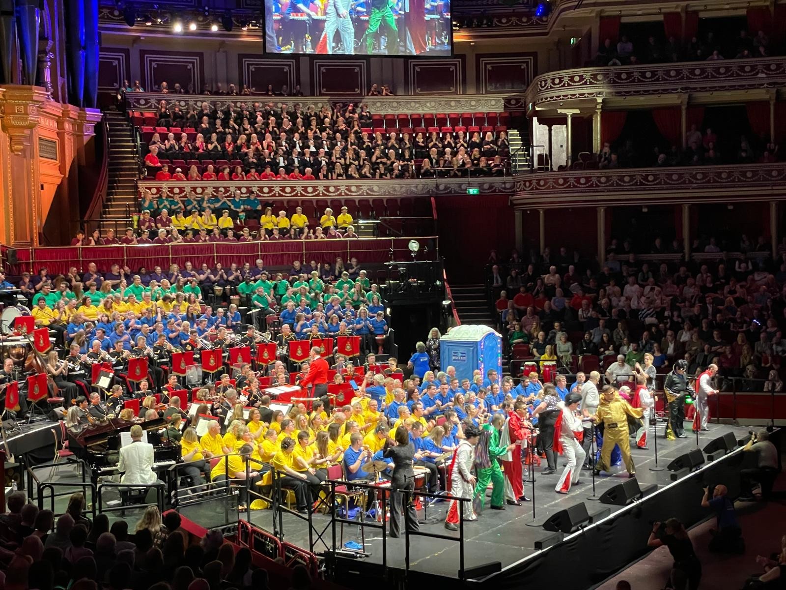 People singing on stage at Royal Albert Hall